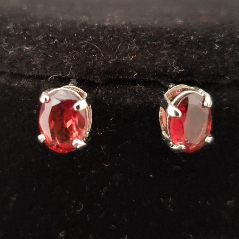 Sterling silver oval red Garnet post earrings.
